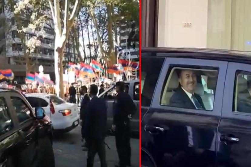 Bakan Çavuşoğlu, Uruguay'da Türkiye aleyhine slogan atan Ermeni protestoculara "Bozkurt" işareti ile yanıt verdi